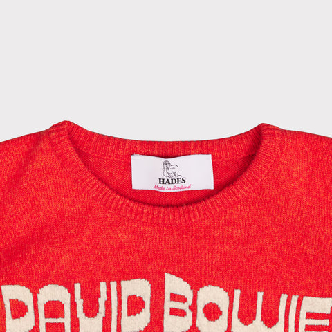 Up close shot of the neckline on the orange and oatmeal women's 'Hunky Dory' David Bowie jumper