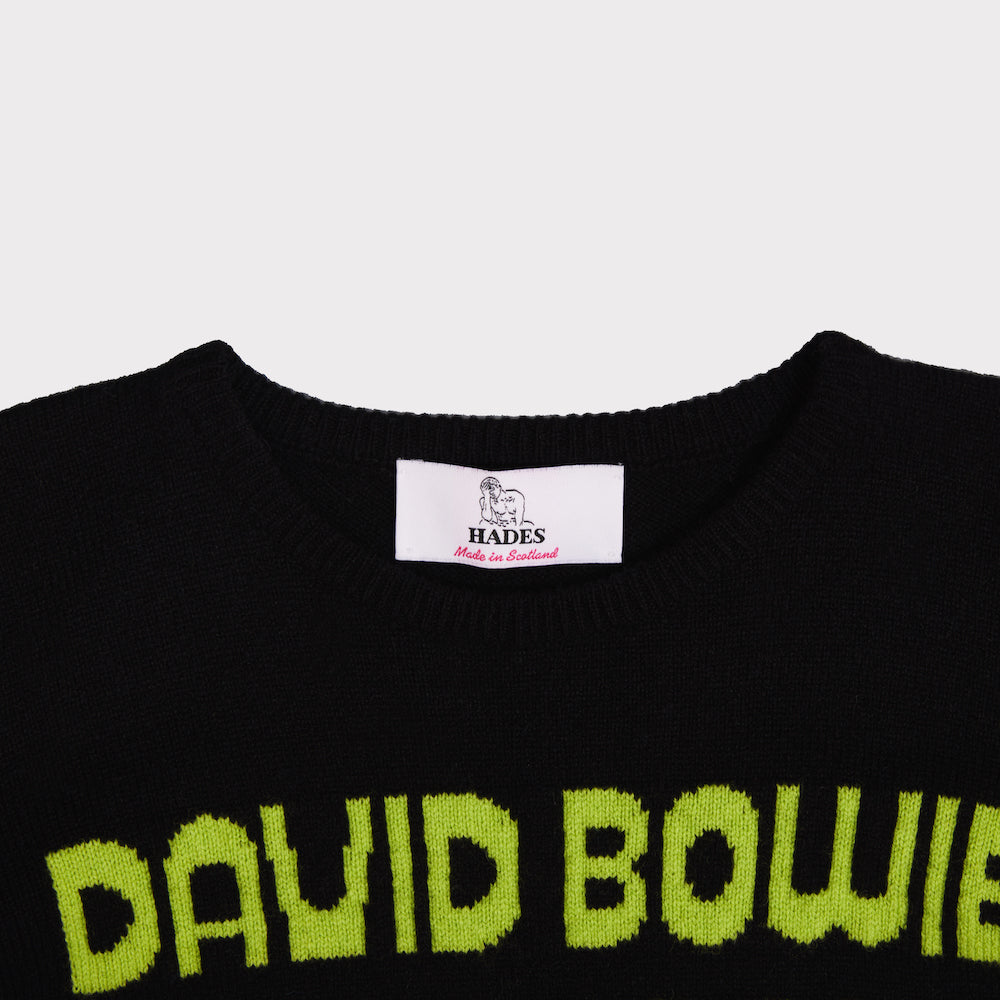 Close up of the neckline on the black and lime men's 'Hunky Dory' jumper