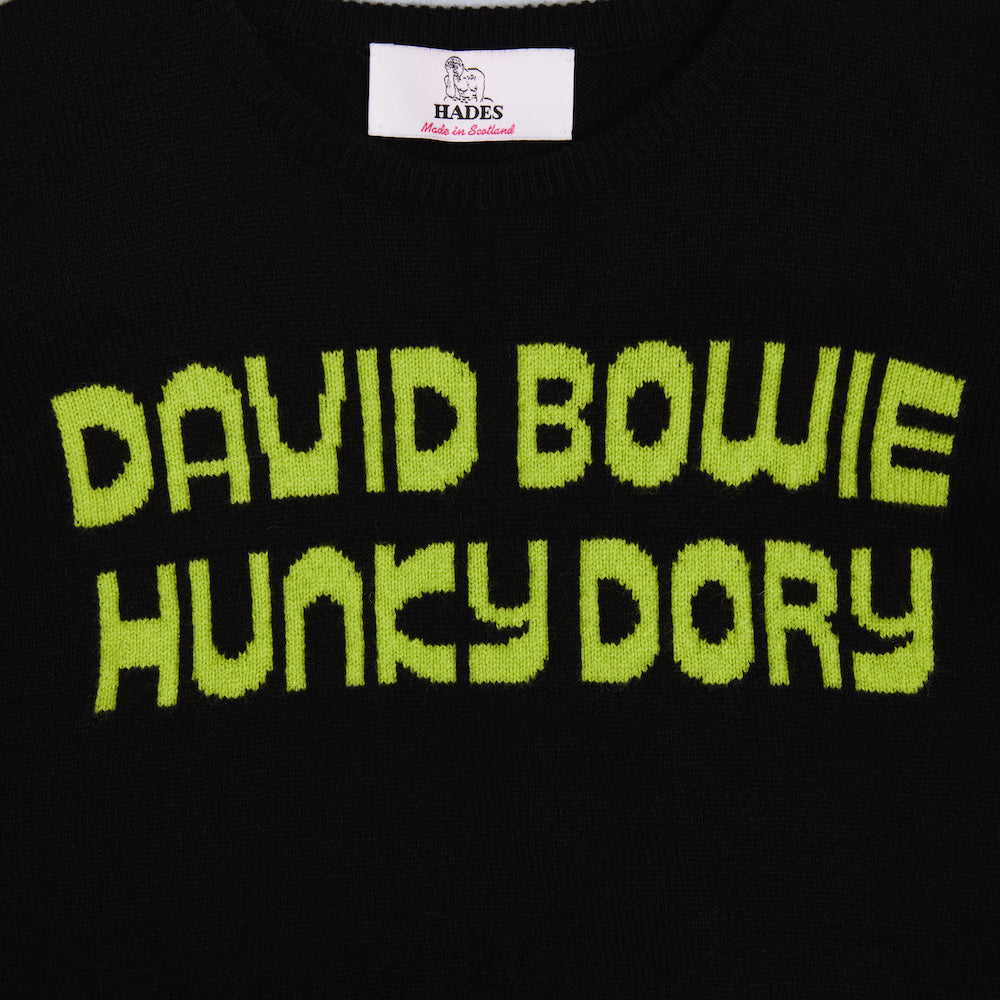 Close up of the text on the black and lime women's 'Hunky Dory' jumper