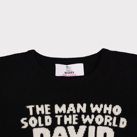 Up close shot of the neckline of the women's black and white 'The man who sold the world' David Bowie jumper