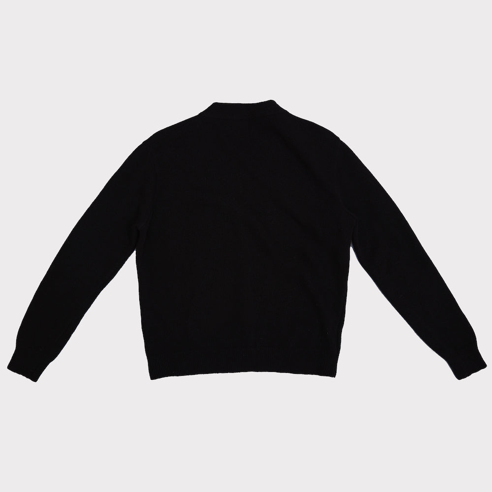 Back flat shot of the black Carrington cardigan with gold plated letters spelling FU*K
