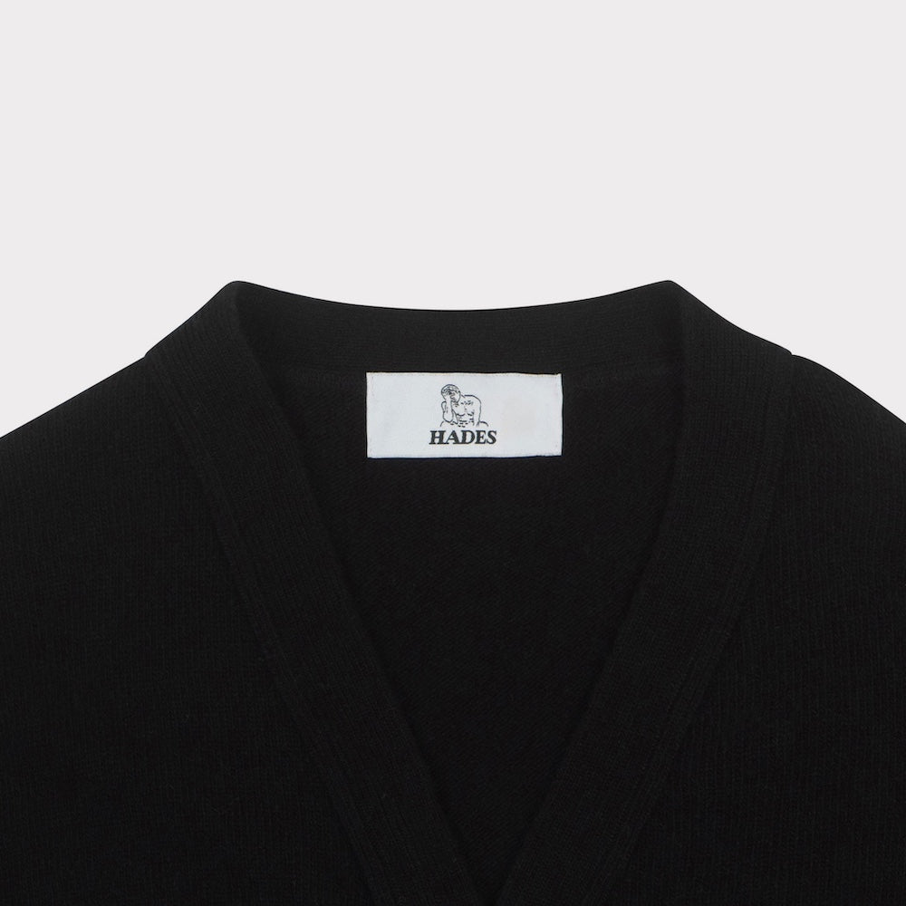 Front flat shot of the black carrington cardigan necklabel