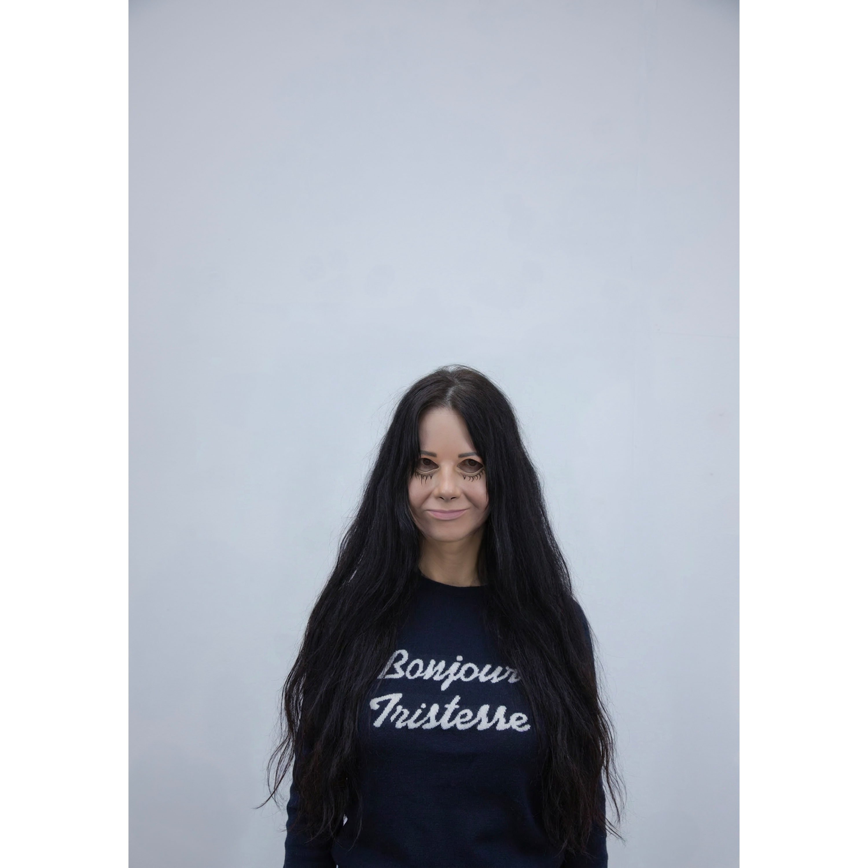 Artist Gillian Wearing wearing a navy knit jumper.