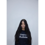 Artist Gillian Wearing wearing a navy knit jumper.