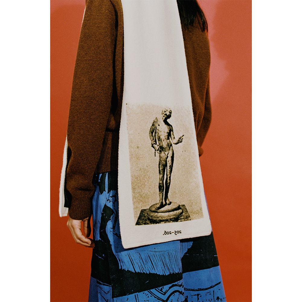 Model wearing the HADES Narcissus scarf in Ivory and Black