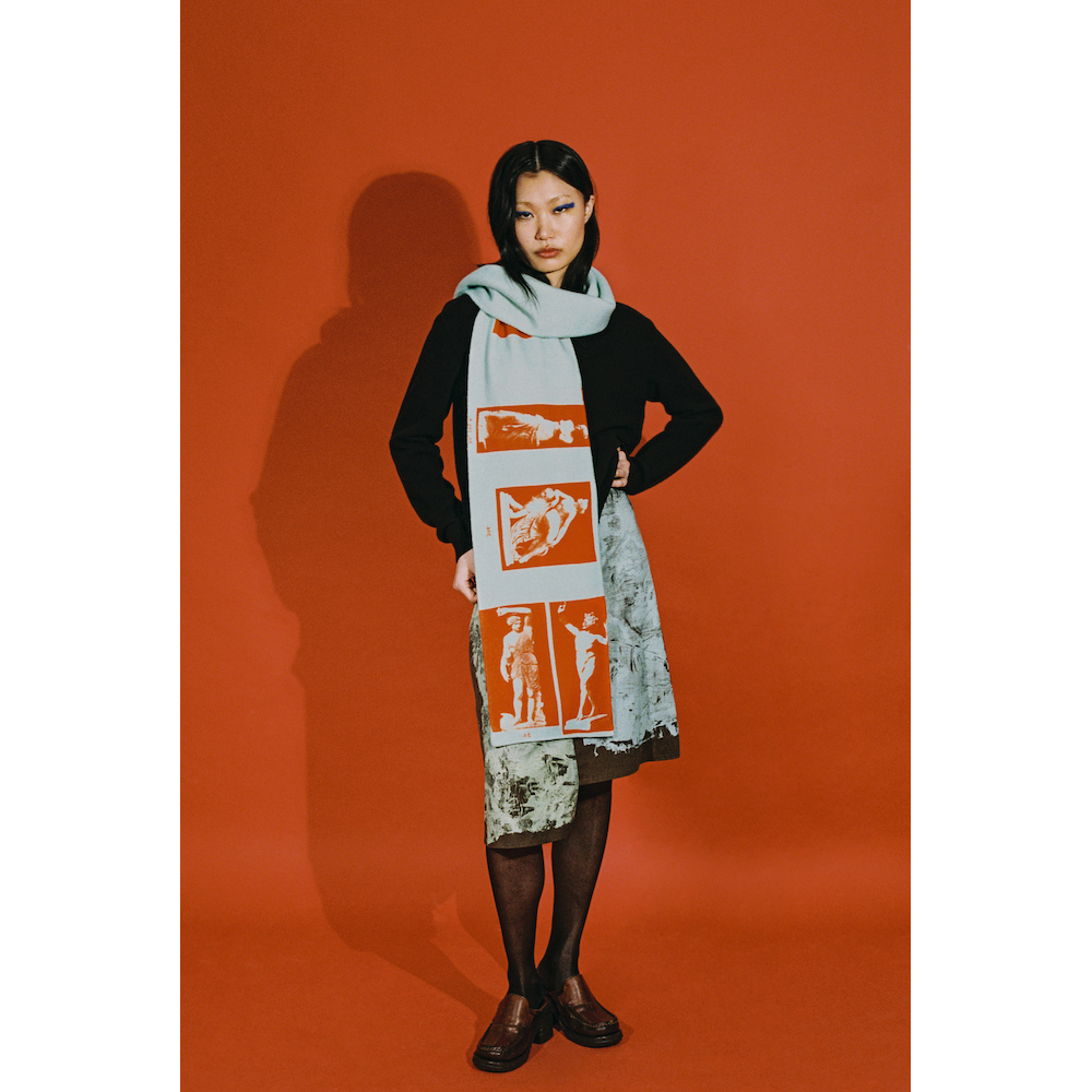 Model wearing the HADES Narcissus scarf in Turquoise and Red