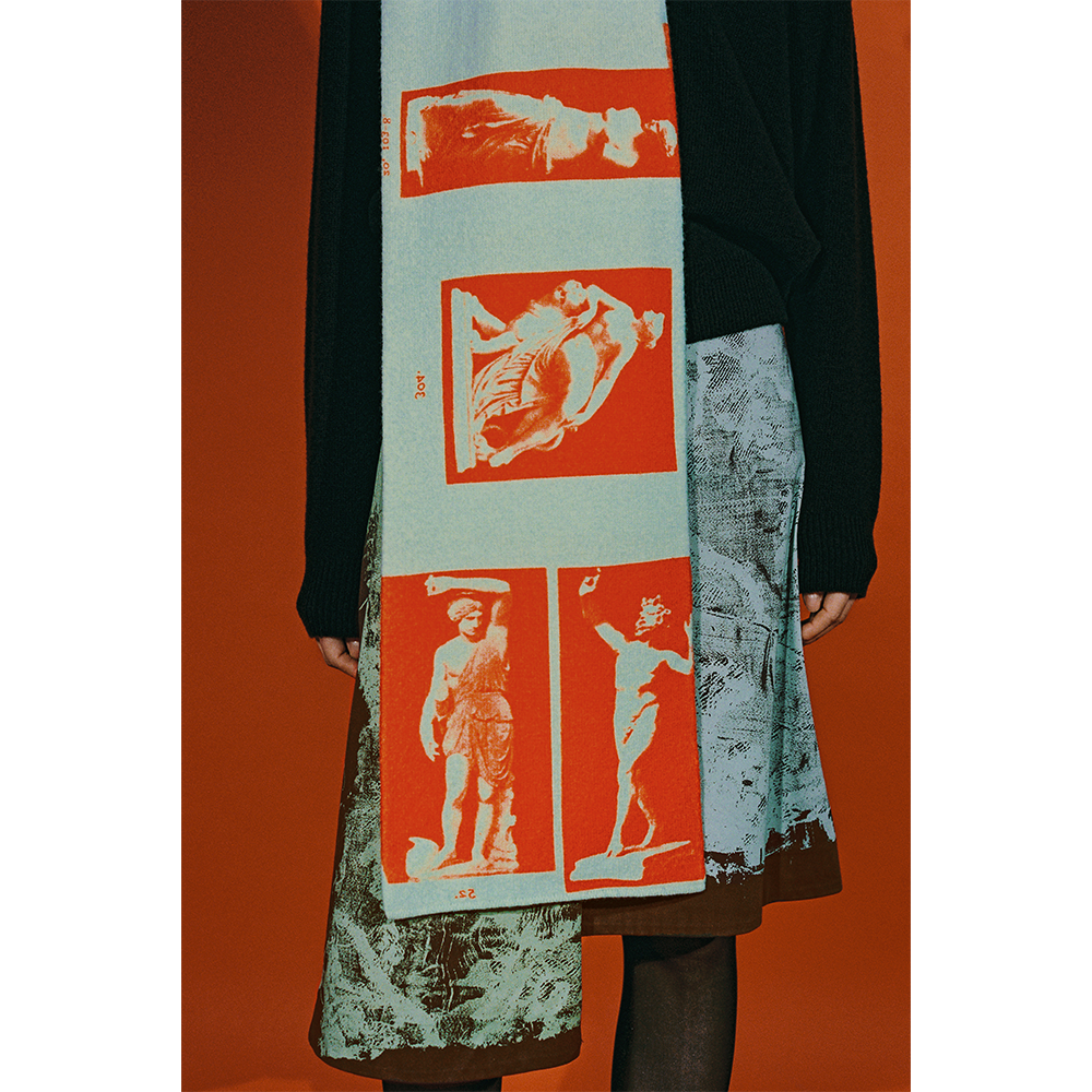 Model wearing the HADES Narcissus scarf in Turquoise and Red