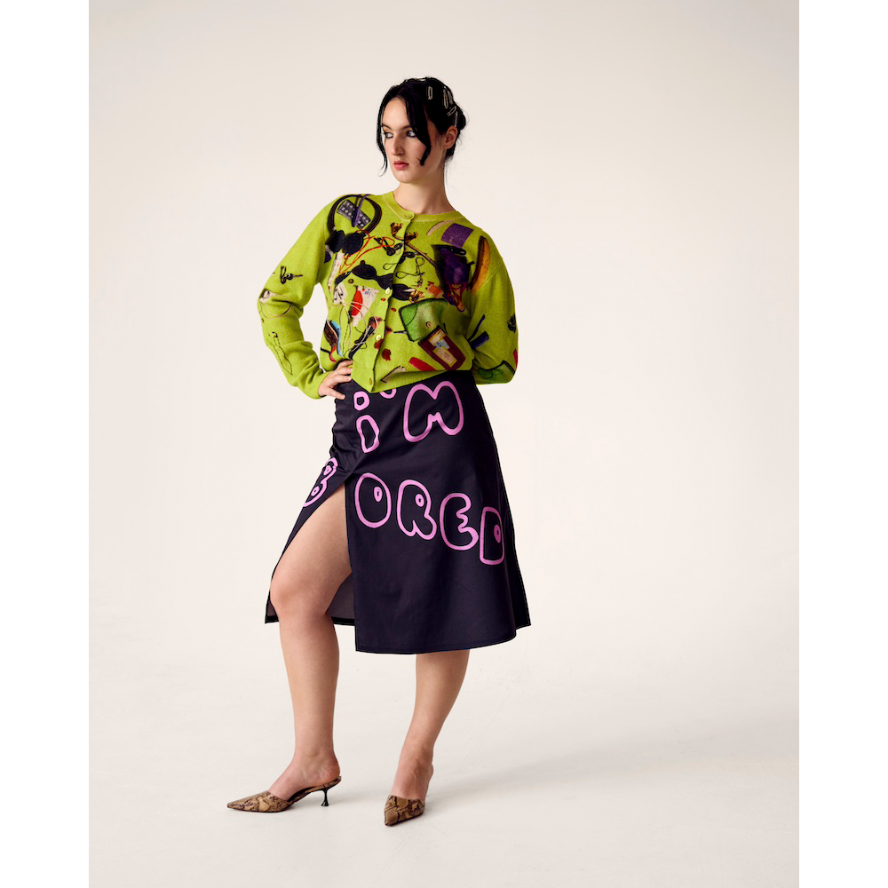 Woman wearing HADES Handbag Cardigan and I'm Bored Skirt