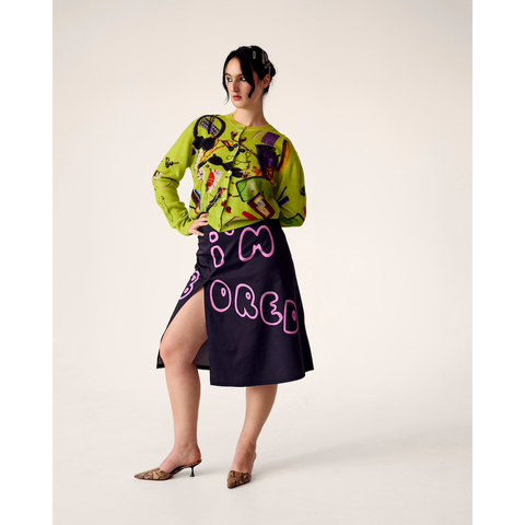 Woman wearing HADES Handbag Cardigan and I'm Bored Skirt