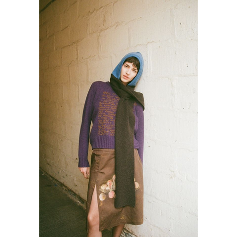 Person wearing HADES blue & brown Hooded Scarf, HADES Peaches skirt and Eternity Knit