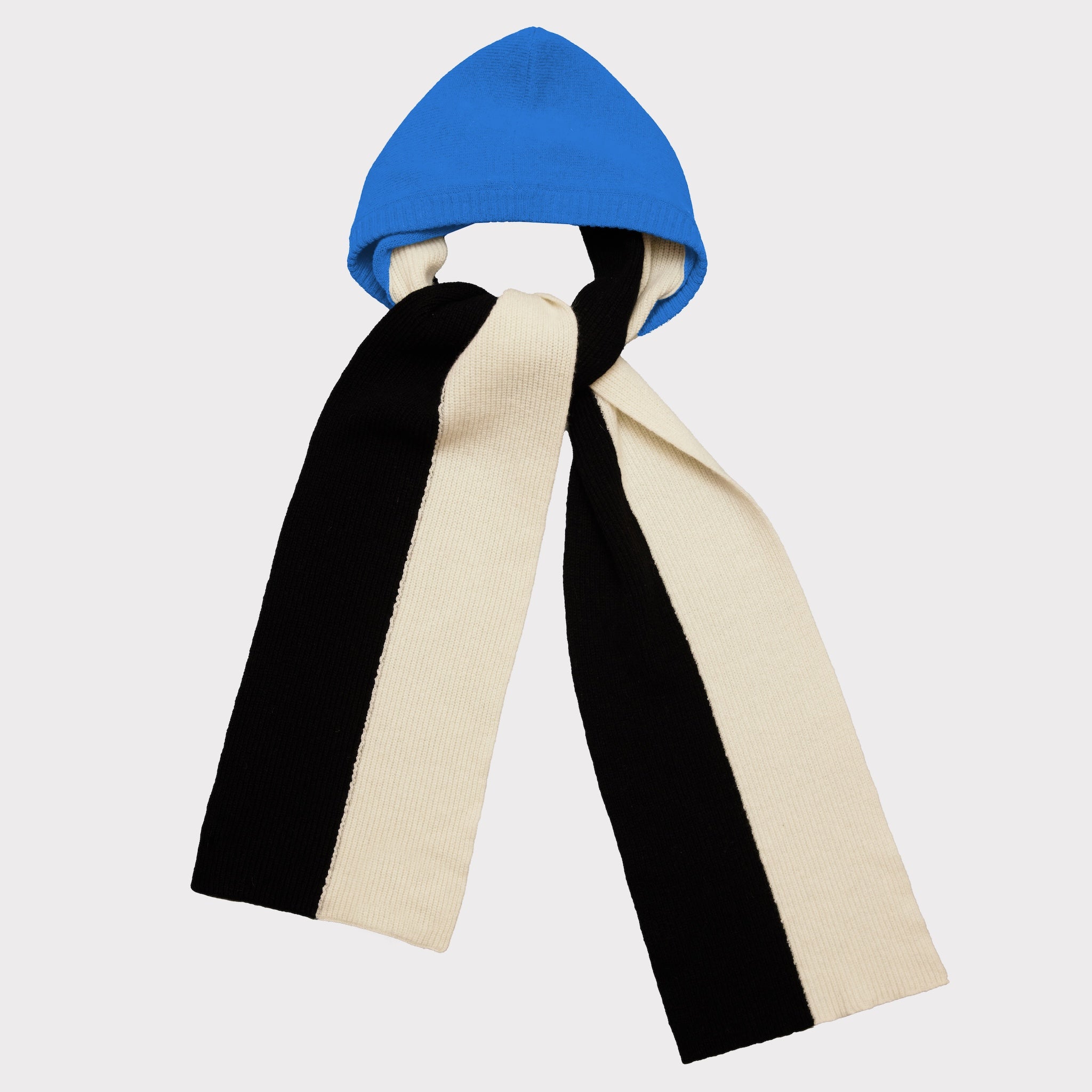 A knit hooded scarf with a bright blue hood and two long vertical stripes in black and cream, shown against a light gray background.