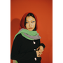 Model wearing HADES red hooded scarf