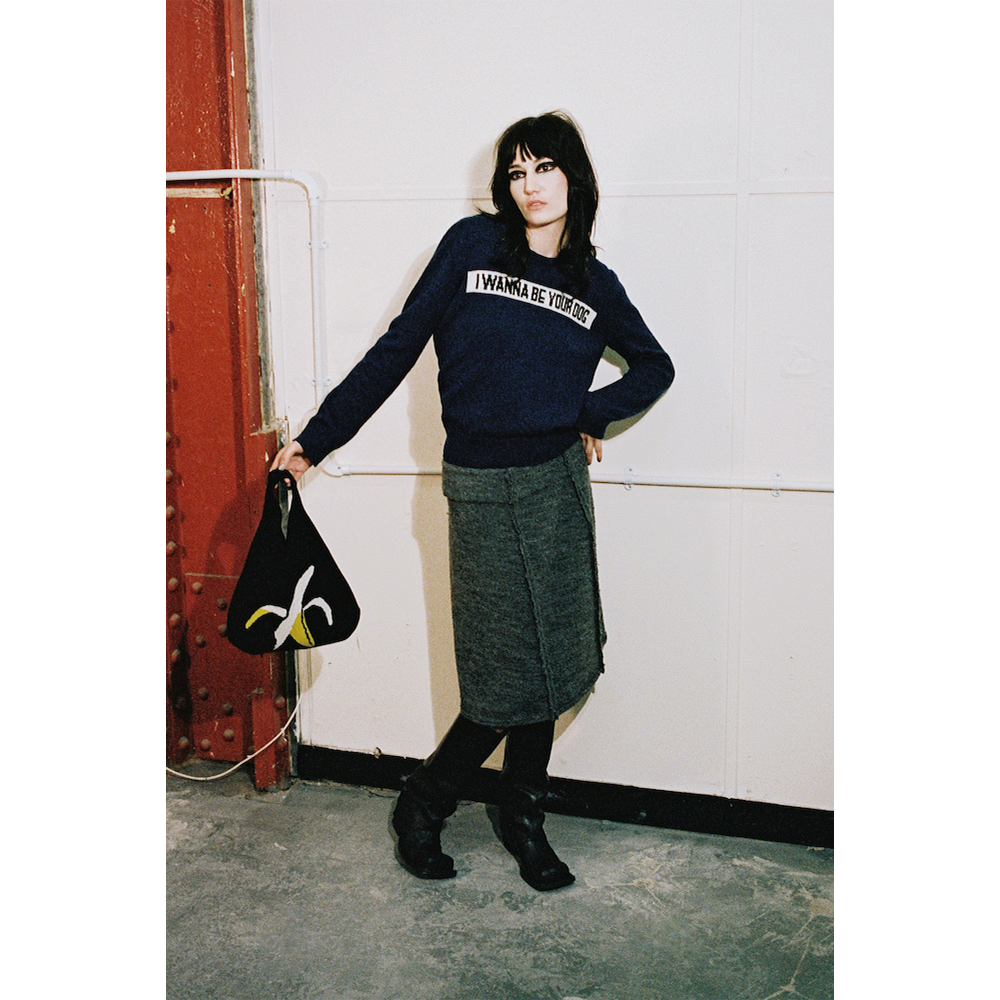 Model holding HADES Banana Bag