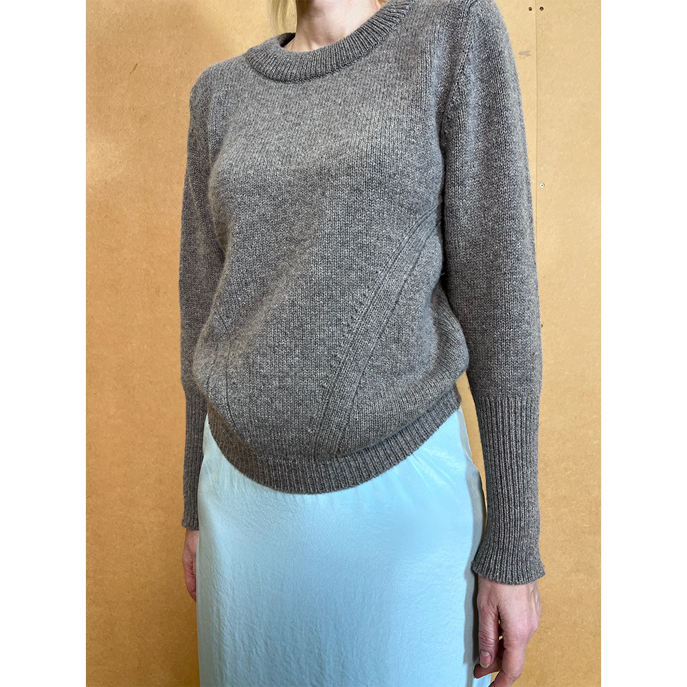 Person wearing HADES gray armour jumper 