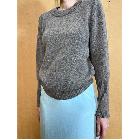 Person wearing HADES gray armour jumper 