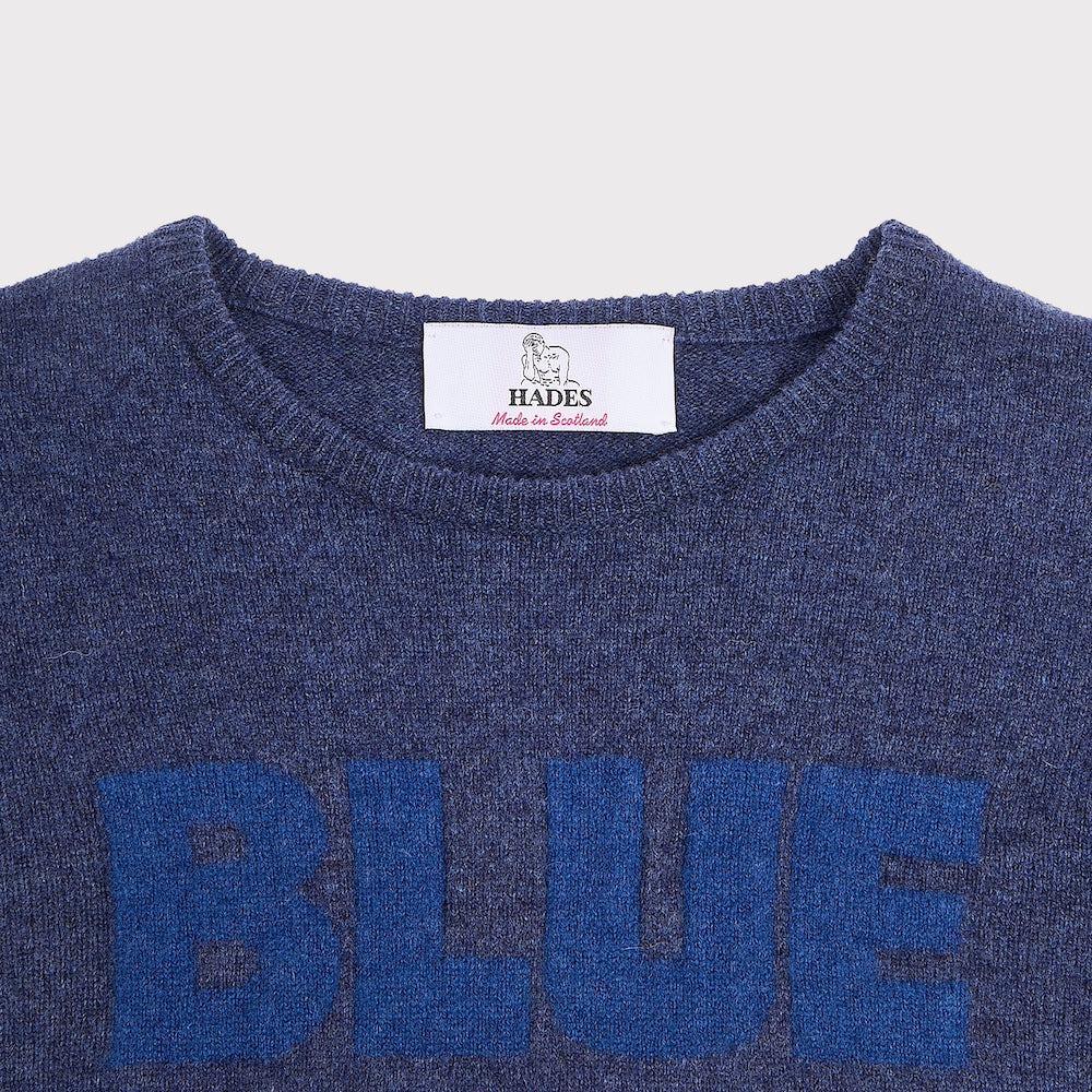 Neck label detail image of the 'BLUE' knit from the Joni Mitchell Collection