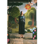 Model wearing the "Make Friends With Chaos" knit and Notes On Radical Living skirt against a faux garden of eden backdrop.