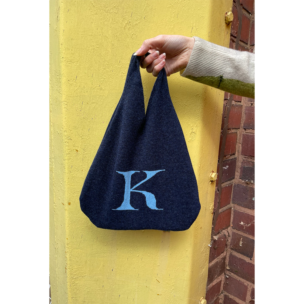 HADES K letter bag held by model