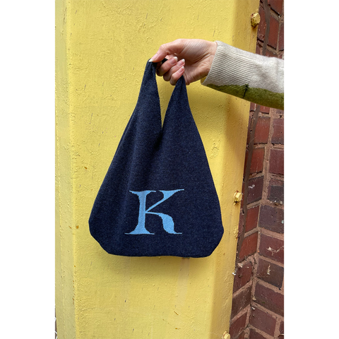 HADES K letter bag held by model