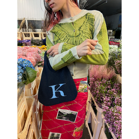 HADES K letter bag worn by model
