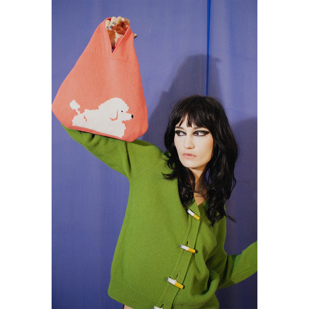 Model holding HADES Poodle Bag