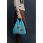 Model holding the Fishbowl Bag