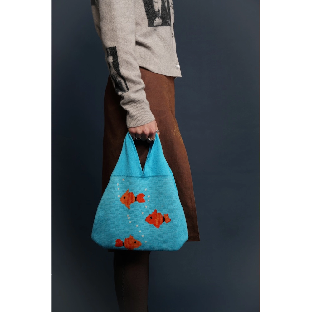 Model holding the Fishbowl Bag
