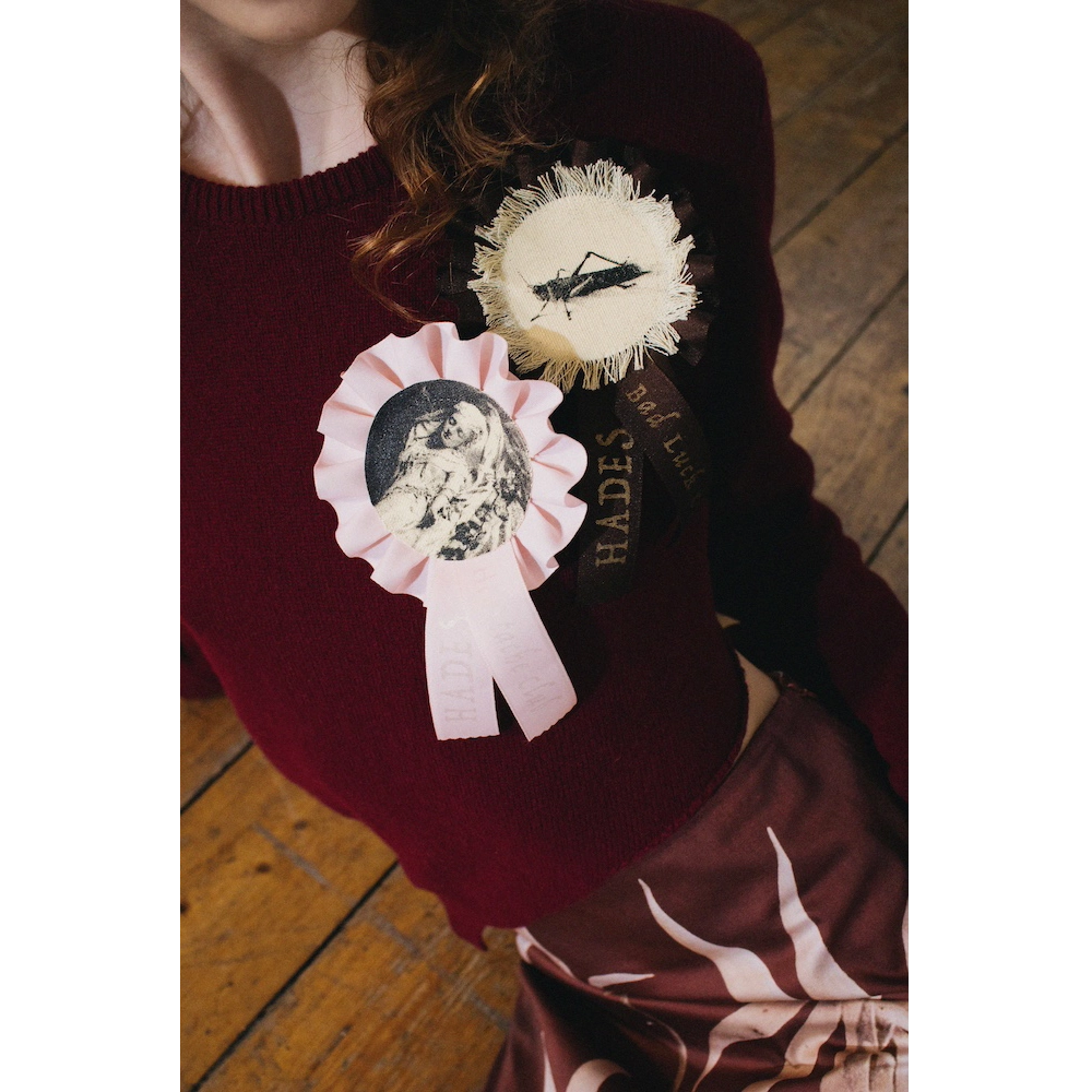Model wearing the HADES Bad Luck Club & Heartache Club Rosettes
