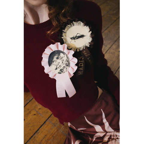 Model wearing the HADES Bad Luck Club & Heartache Club Rosettes