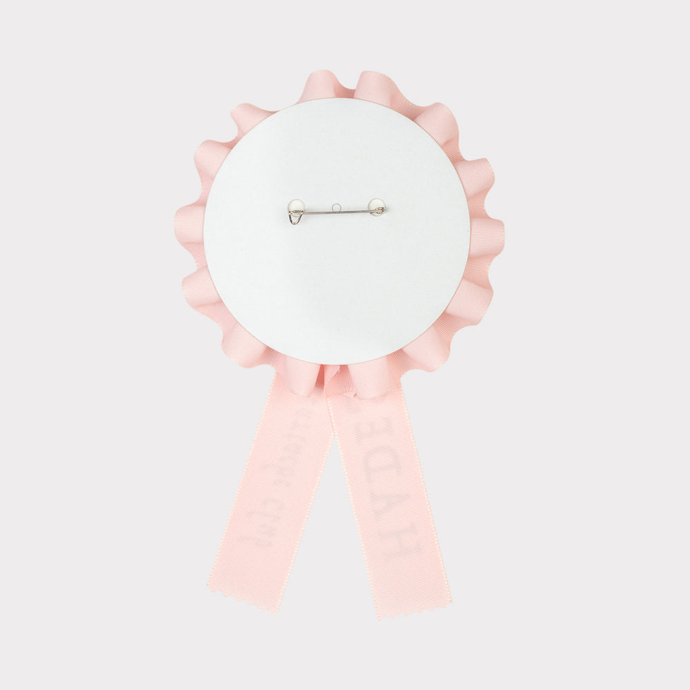 Image of the back of the HADES Heartache Club Rosette