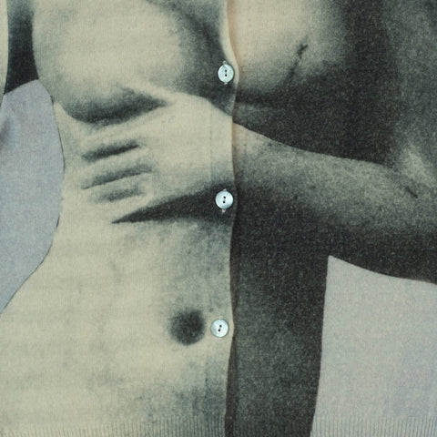 Close-up of a person wearing a buttoned cardigan