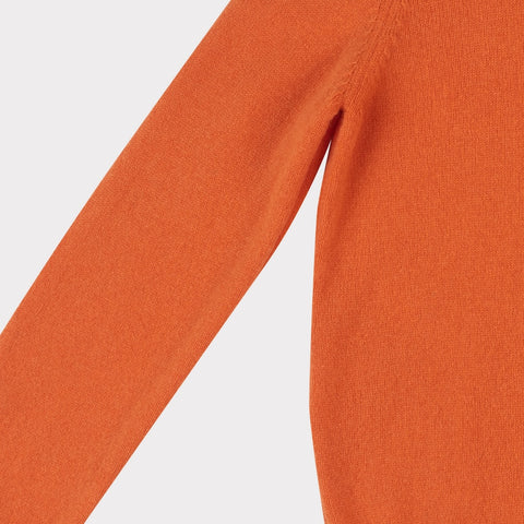 Arm flat shot of the orange Sabi knit