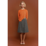 Model wearing the orange Sabi knit & The Inside Out Skirt