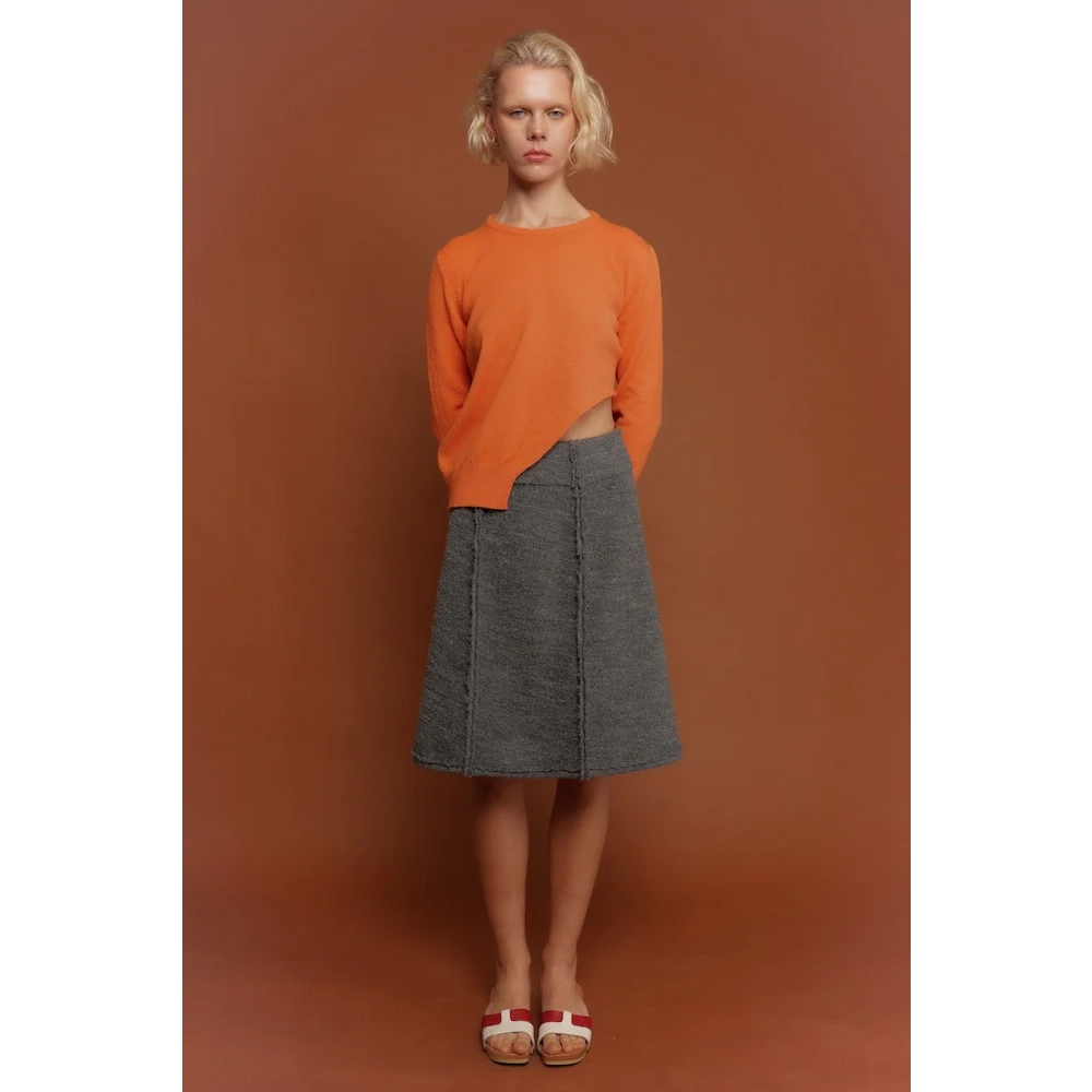 Model wearing the orange Sabi knit & The Inside Out Skirt