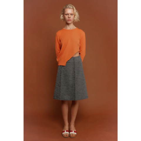 Model wearing the orange Sabi knit & The Inside Out Skirt