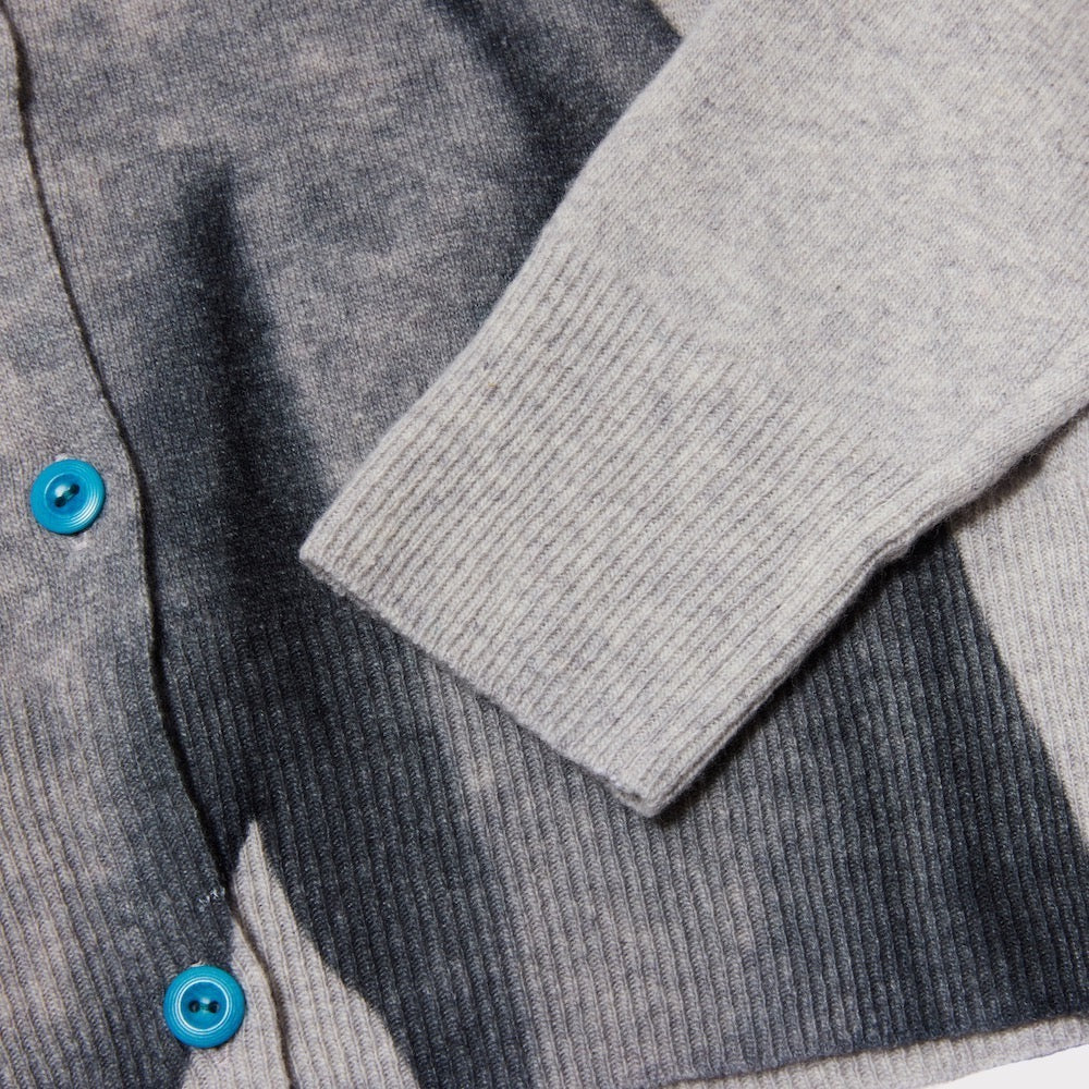 Detail flatshot showing the texture and buttons of The Kissing Cardigan