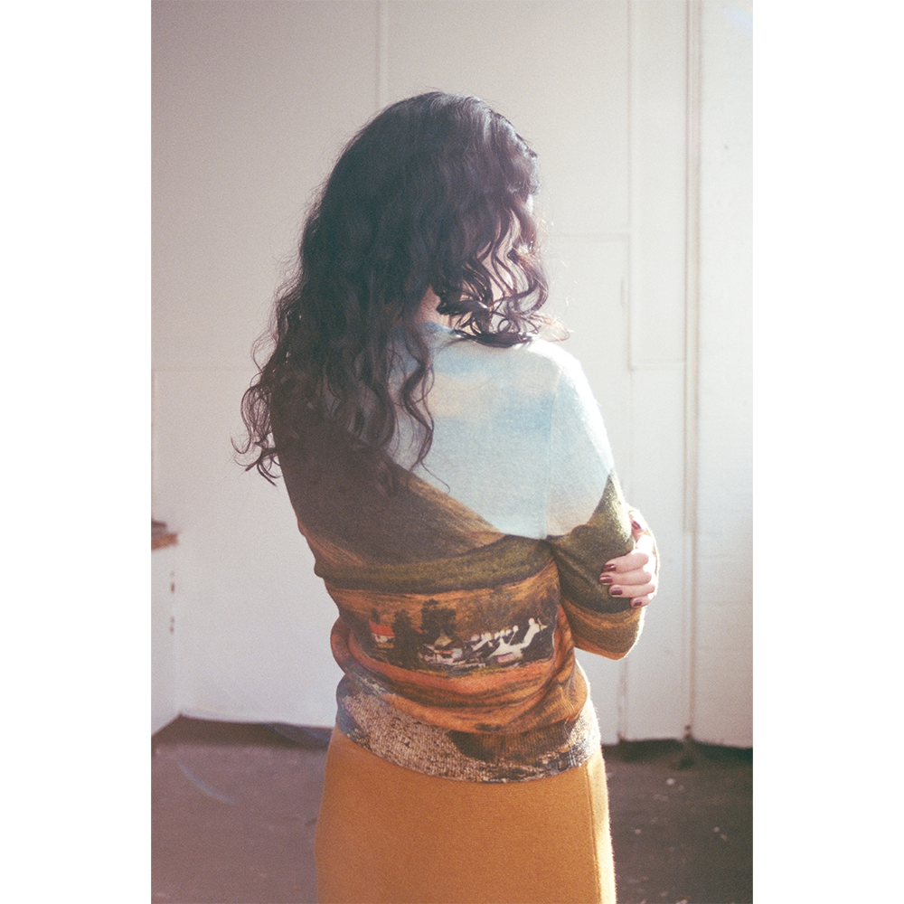 Model wearing the Countryside In Colour cardigan back of knit