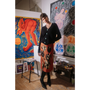 Person standing in an art studio wearing HADES AW25 Skirt