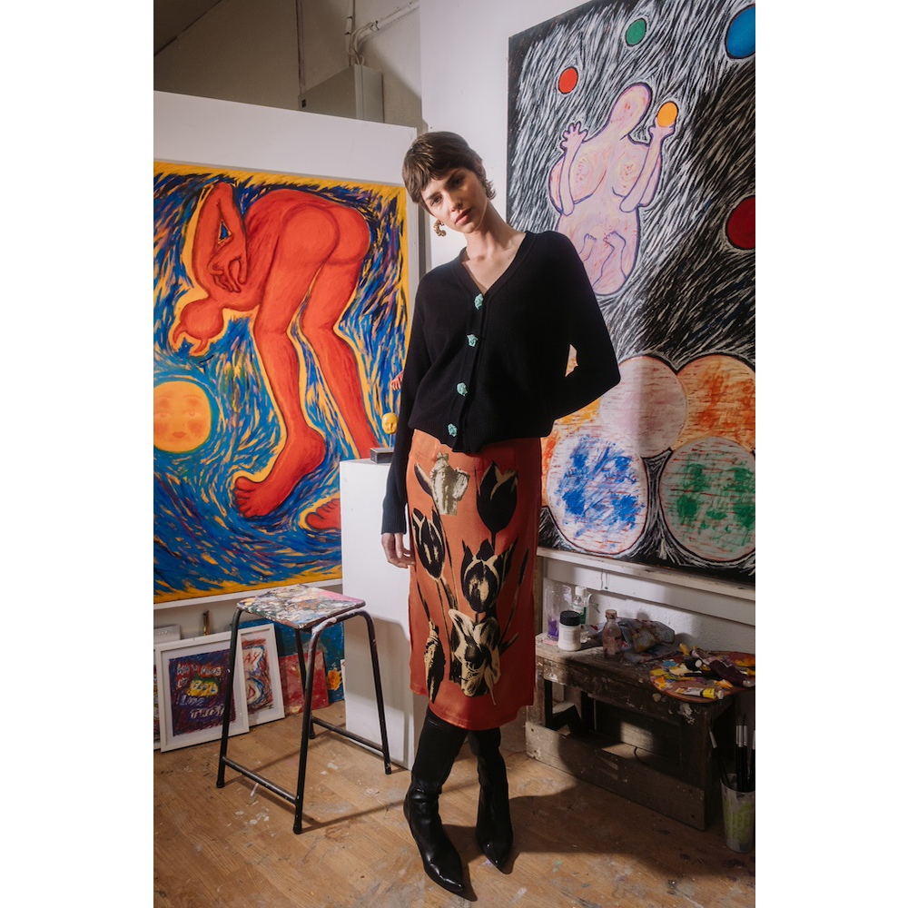 Person standing in an art studio wearing HADES AW25 Skirt