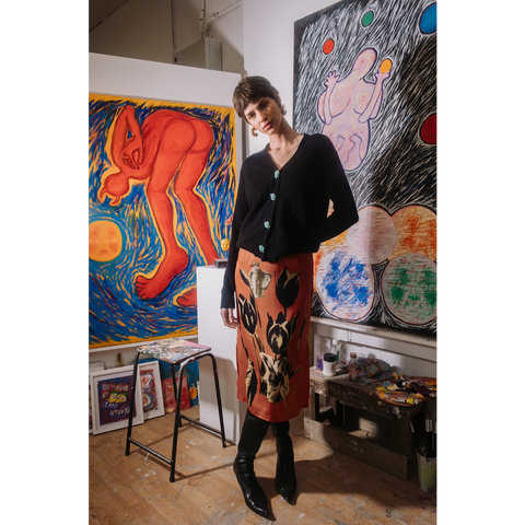 Person standing in an art studio wearing HADES AW25 Skirt