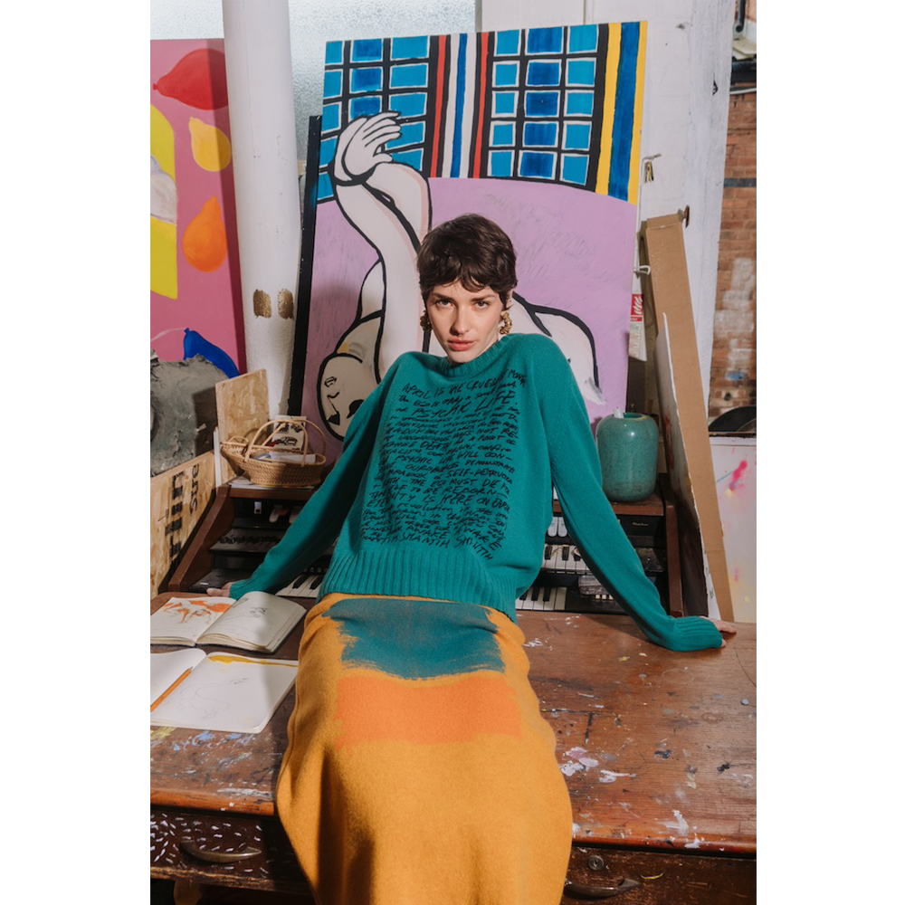 Model wearing HADES jade Manifesto Jumper