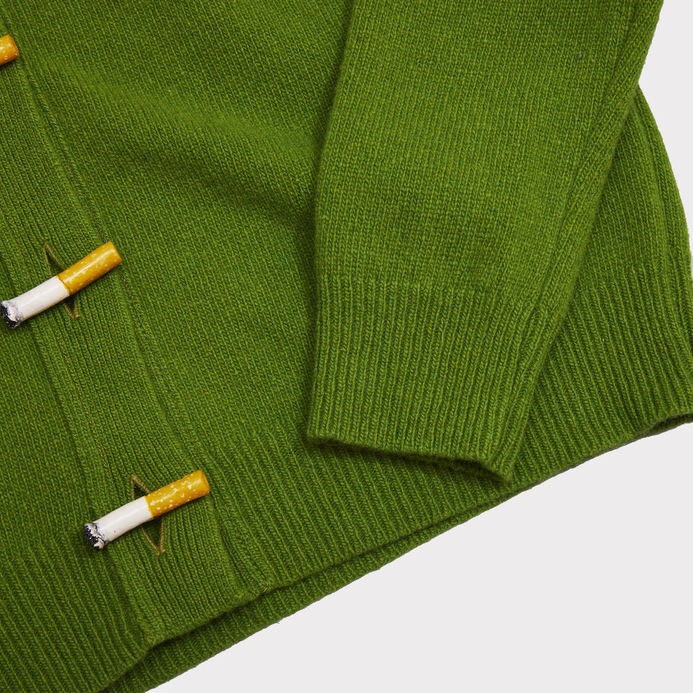 Close up shot of the green Cigarette Carrington cardigan. 