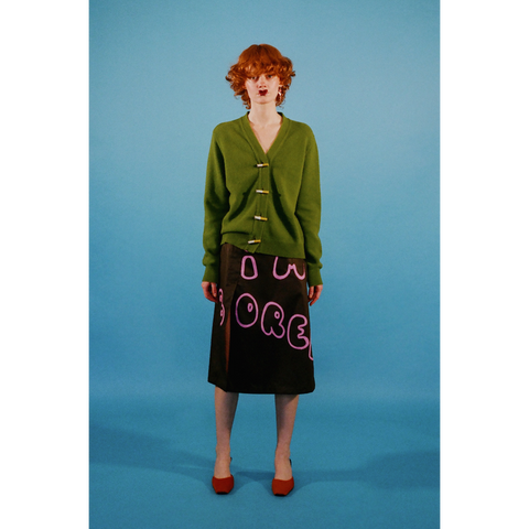 Model wearing the 'I'm bored' skirt styled with the Cigarette cardigan