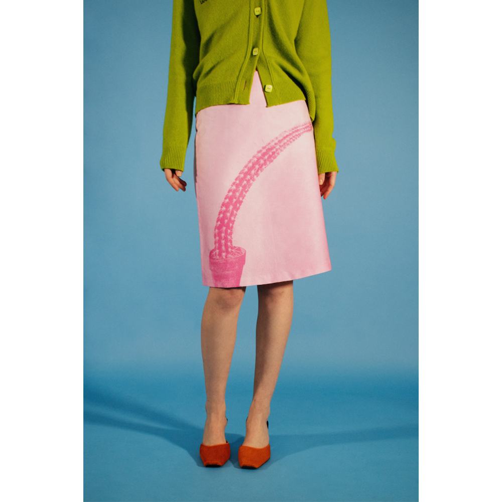 Model wearing the Phallic skirt styled with the HADES lime cardigan