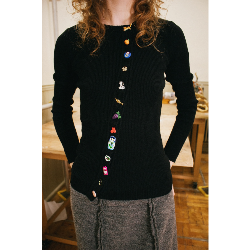 Model wearing Asymmetrical Cardigan button details