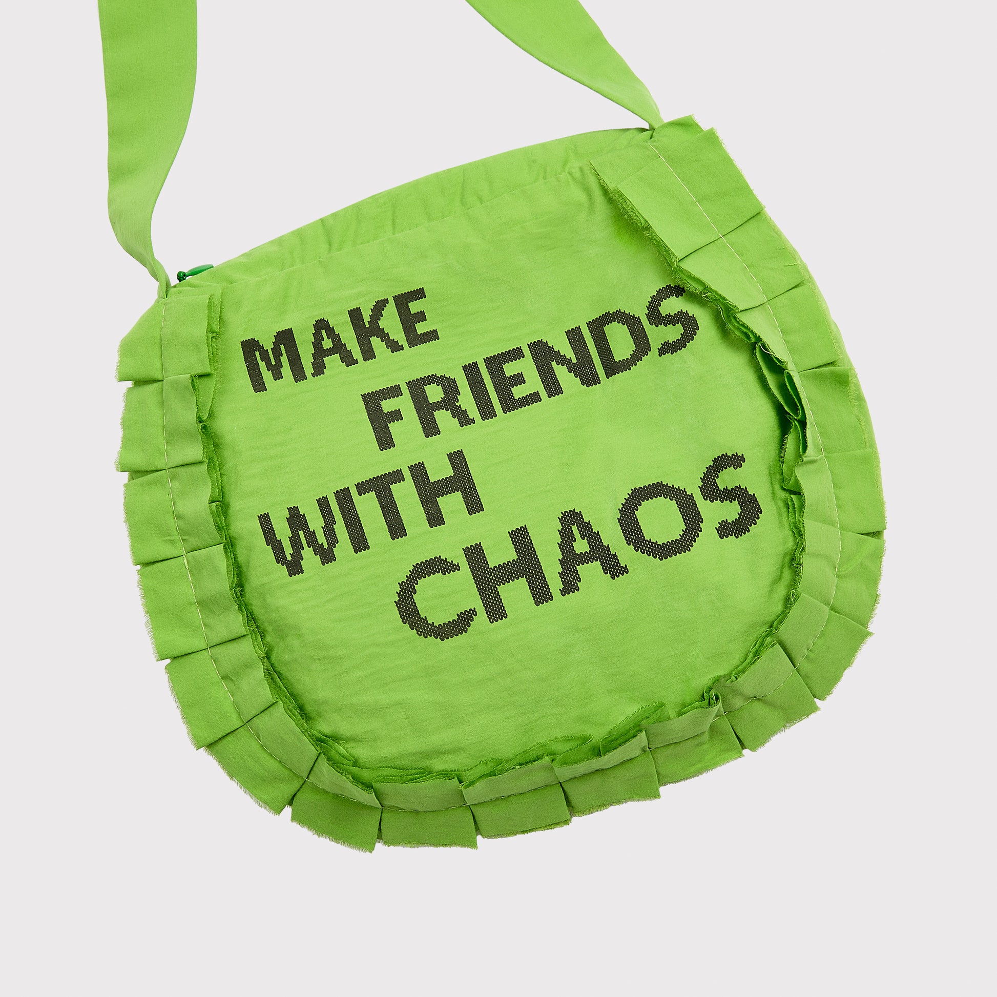 Close up flatshot of the "Make Friends With Chaos" bag.