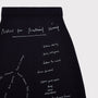 Close up flatshot of "Notes For Radical Living" skirt.