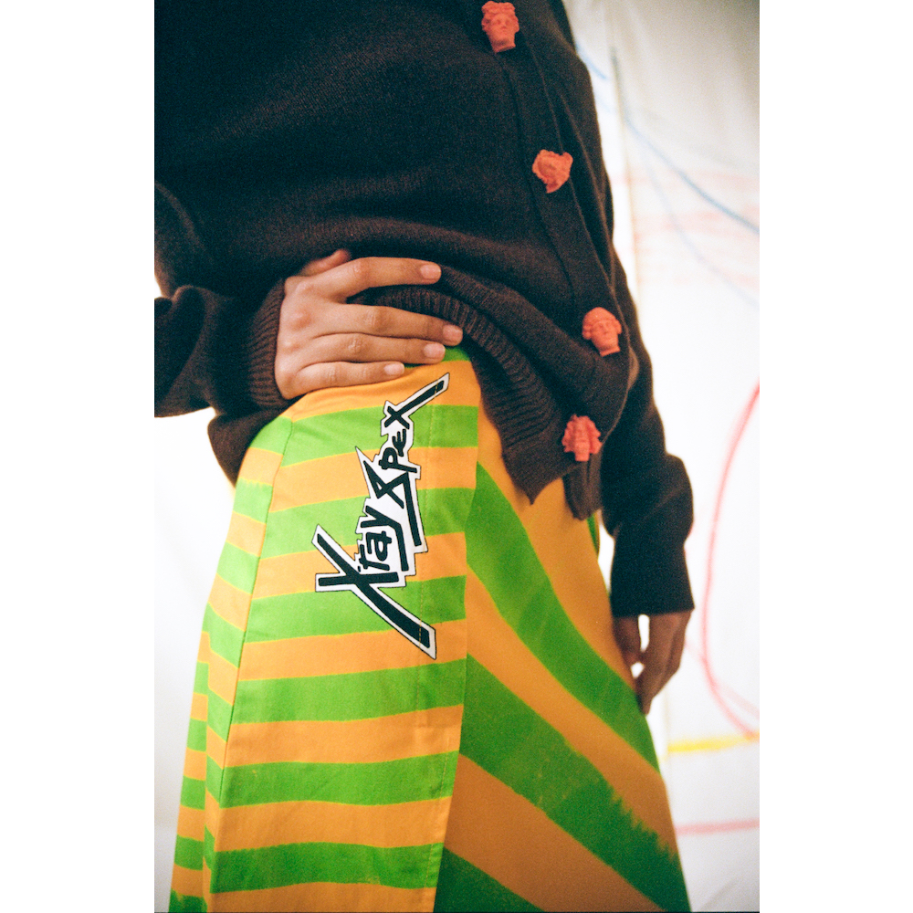 Up close shot of the model wearing the 'Day-Glo' skirt focusing on the X-Ray Spex logo