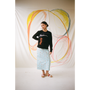 Model wearing the 'I am a Cliché' jumper styled with the Dorothea skirt