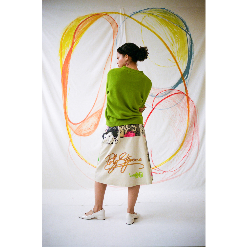 Model wearing the 'I Am A Poseur' skirt styles with the HADES Lime Logo cardigan.